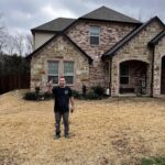 Pro-Craft Restoration technician standing in front of a completed residential restoration project.
