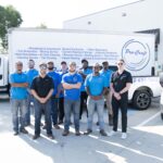 Pro-Craft Restoration mitigation team gathered outside with restoration vehicles.